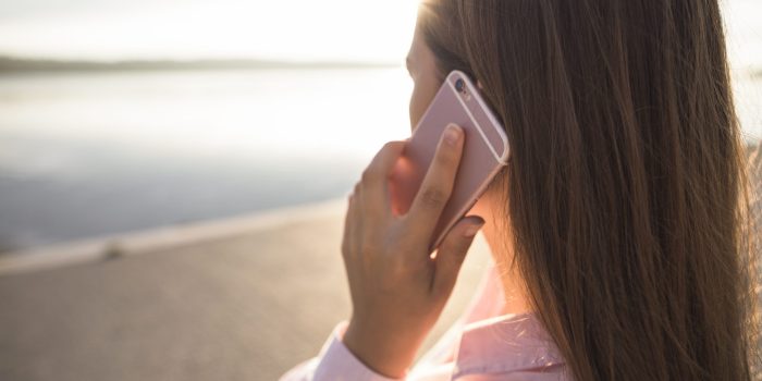 rear-view-woman-talking-cellphone